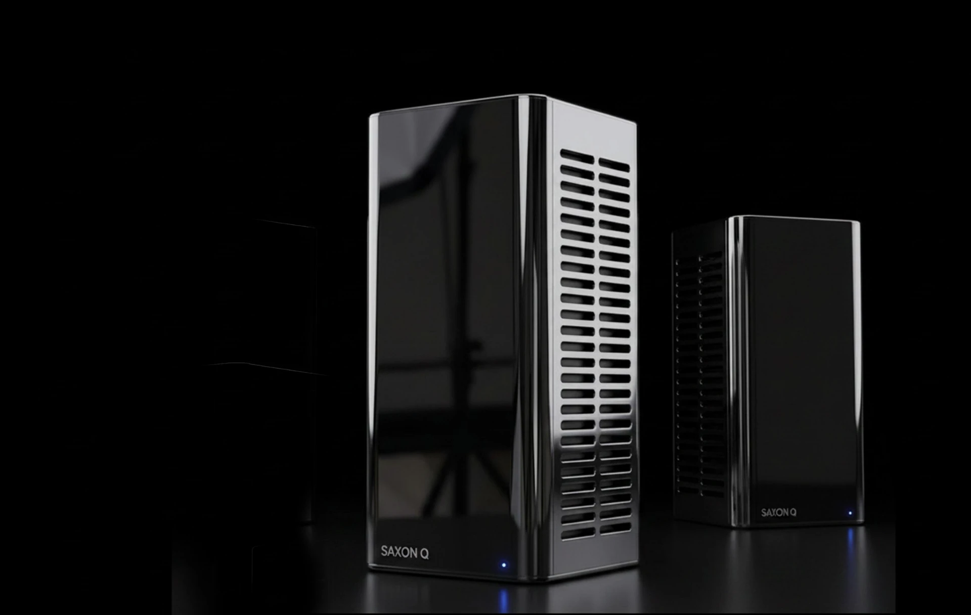 Two SaxonQ mobile quantum computing base units in a dark studio